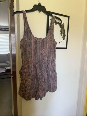 Roxy Love Bug romper featuring a pink and gray paisley pattern.